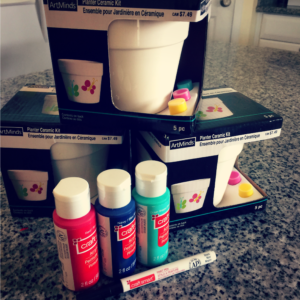 These fun and easy to make hand print flower pots are perfect for Mother's Day! They are sure to become beloved keepsakes. #diy #kidscrafts #handprintcrafts #mothersdaycraft #kidshandprint #cutkidsgift